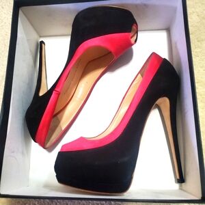 A two toned Fushia & Black built in platform pumps